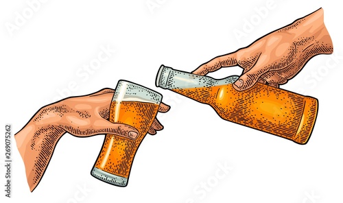 Male finger pouring beer from bottle into glass. The Creation of Adam.