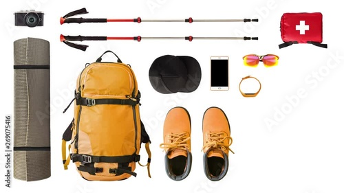 Set of sport equipment and gear for hiking and trekking isolated on white background. Stop motion time lapse