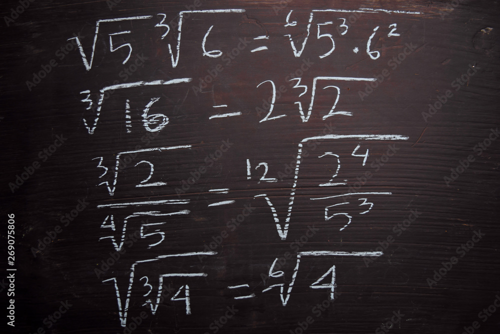 Close up math formulas written on a blackboard. Education concept Close up math formulas written on a blackboard. Education concept