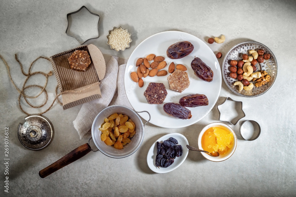 Fototapeta premium Natural helpful candy from dates, nuts, honey and raisins. Healthy food