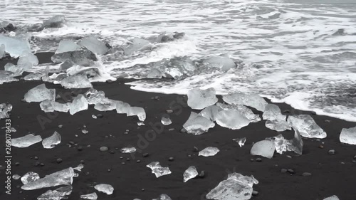 water crashing on beautiful diamond beach in iceland ice