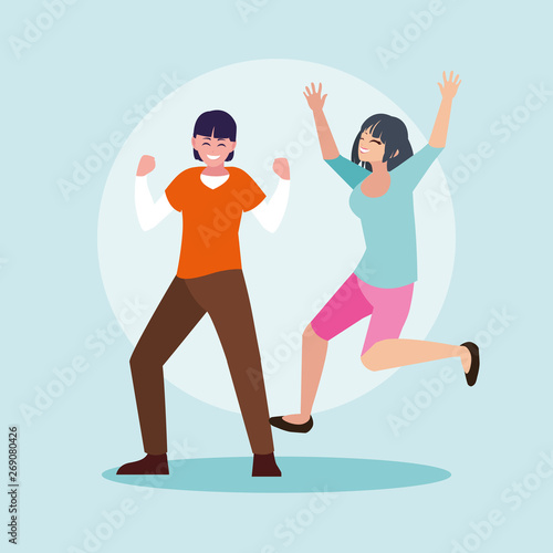 young couple celebrating with hands up