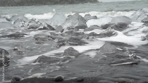 water crashing on beautiful diamond beach in iceland ice