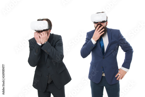Testing new technologies. modern technology in agile business. businessmen wear VR glasses. mature men with beard in suit. Digital future and innovation. virtual reality. Partnership and teamwork