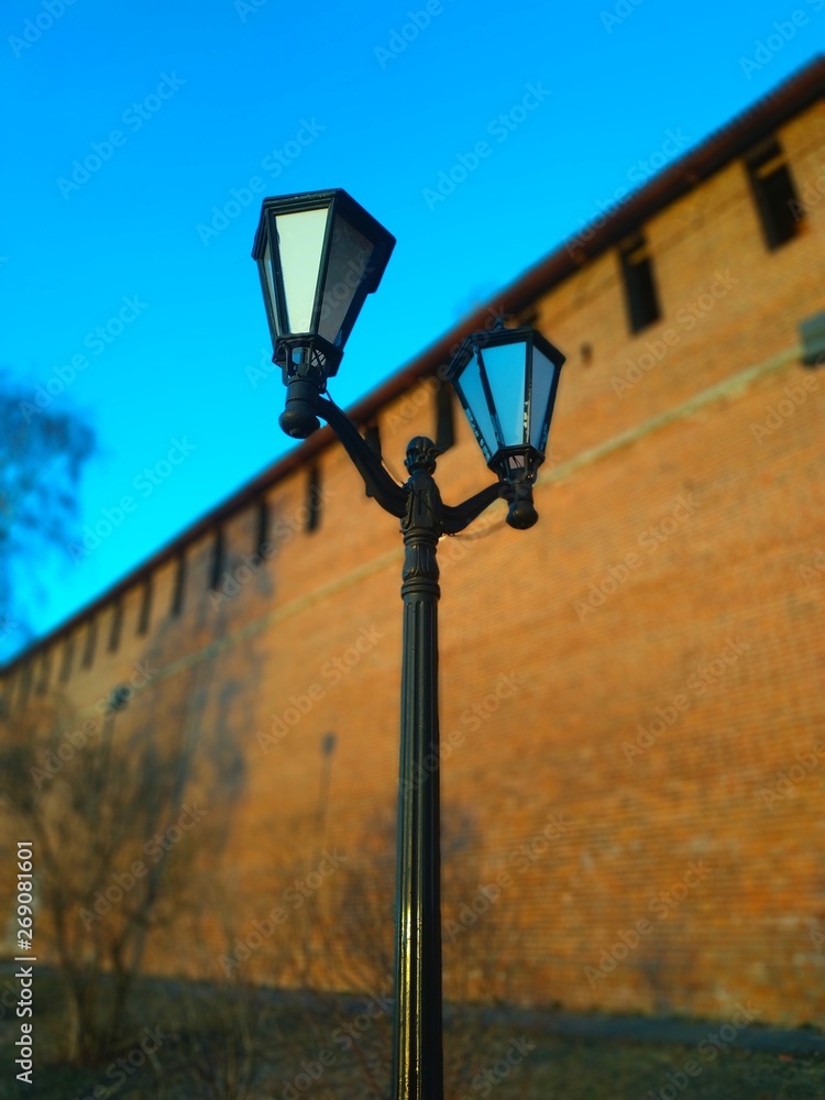street lamp in front of a building