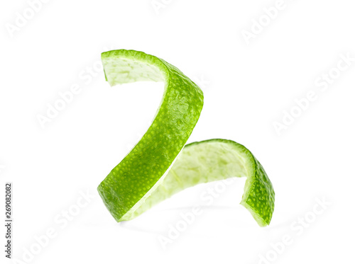 Lime skin isolated on a white background. Green lemon twist.