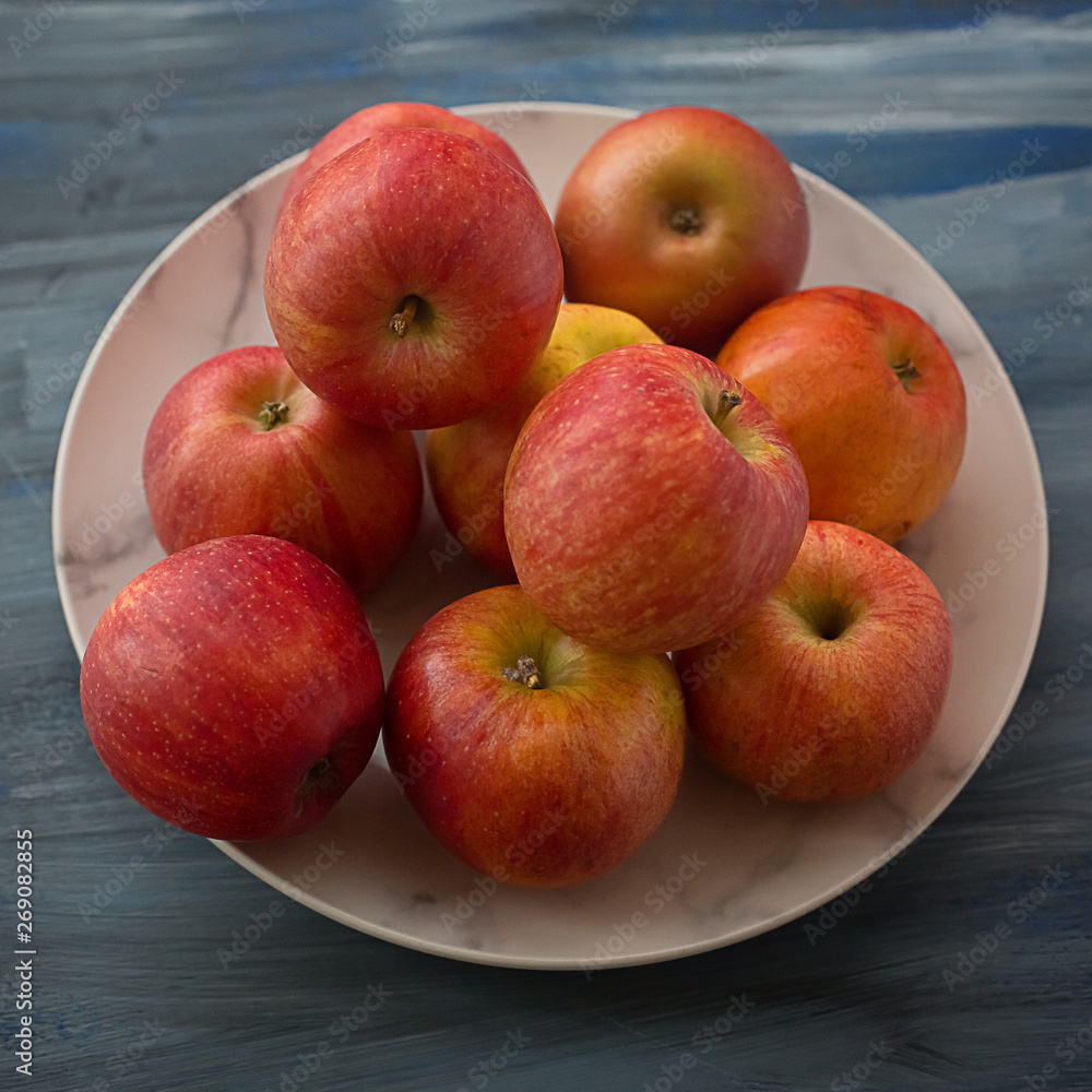 Red ripe apples on a plate Red ripe apples on a plate