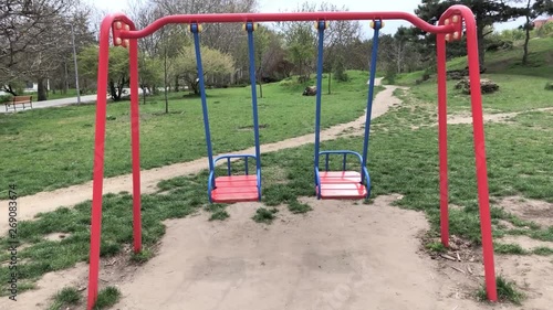 Children’s swings moving back and forth