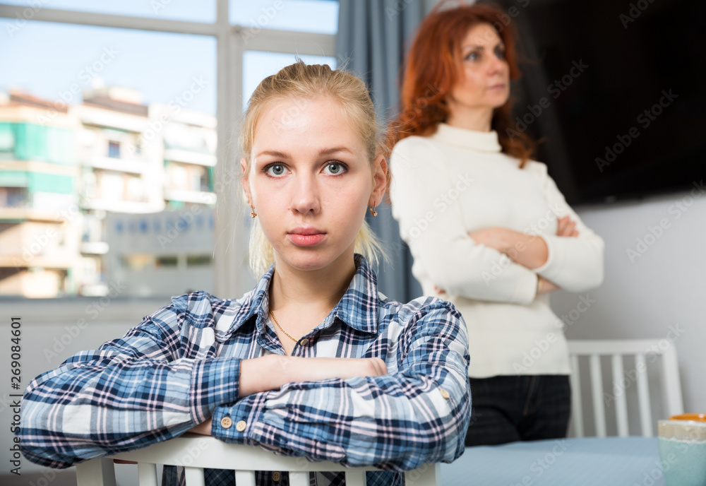 Mature mother soothes adult daughter