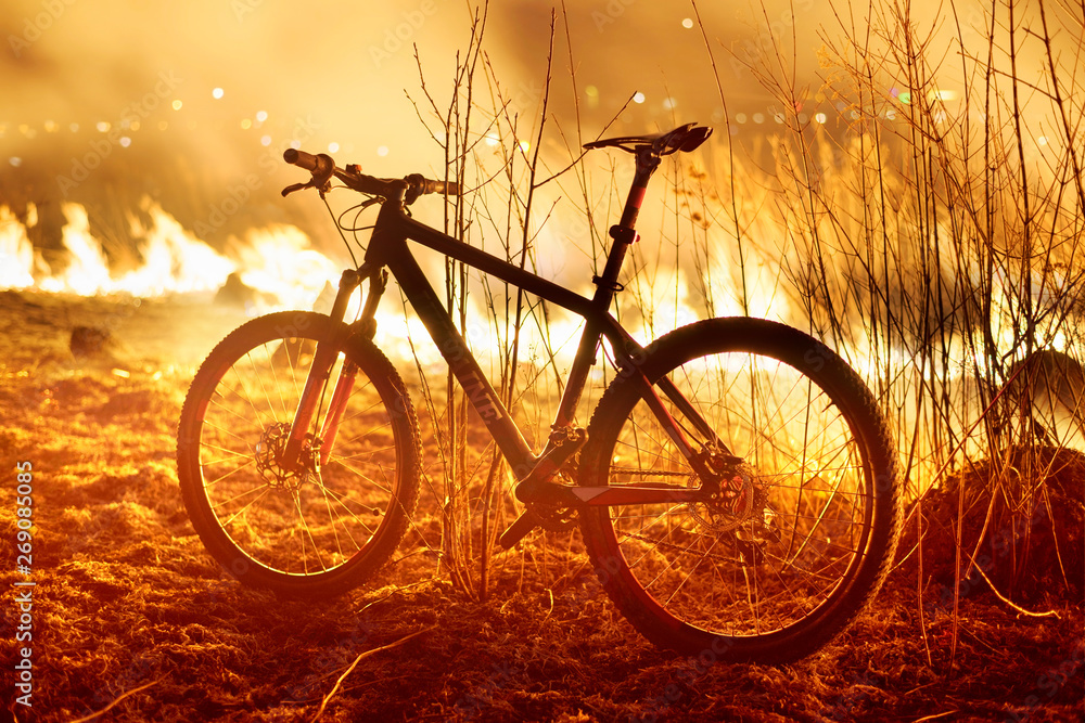 Naklejka premium bike on fire field