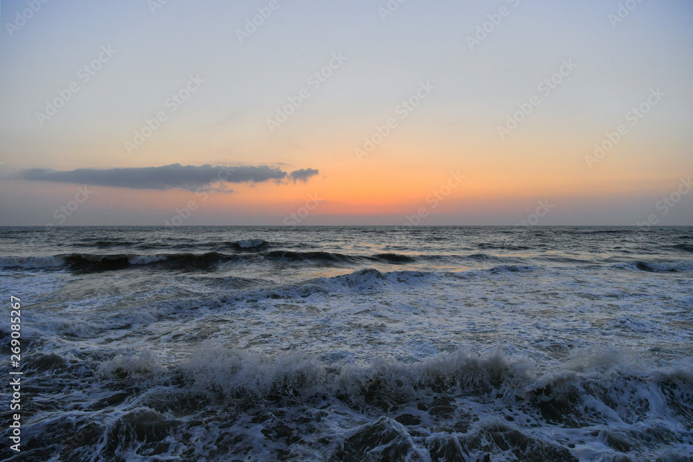 Beautiful minimalist seascape - sunset over water 