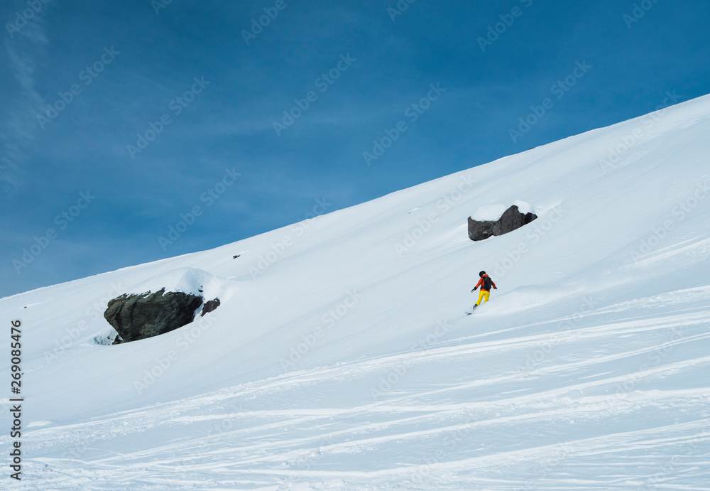 Skiers off piste in alpine ski resort