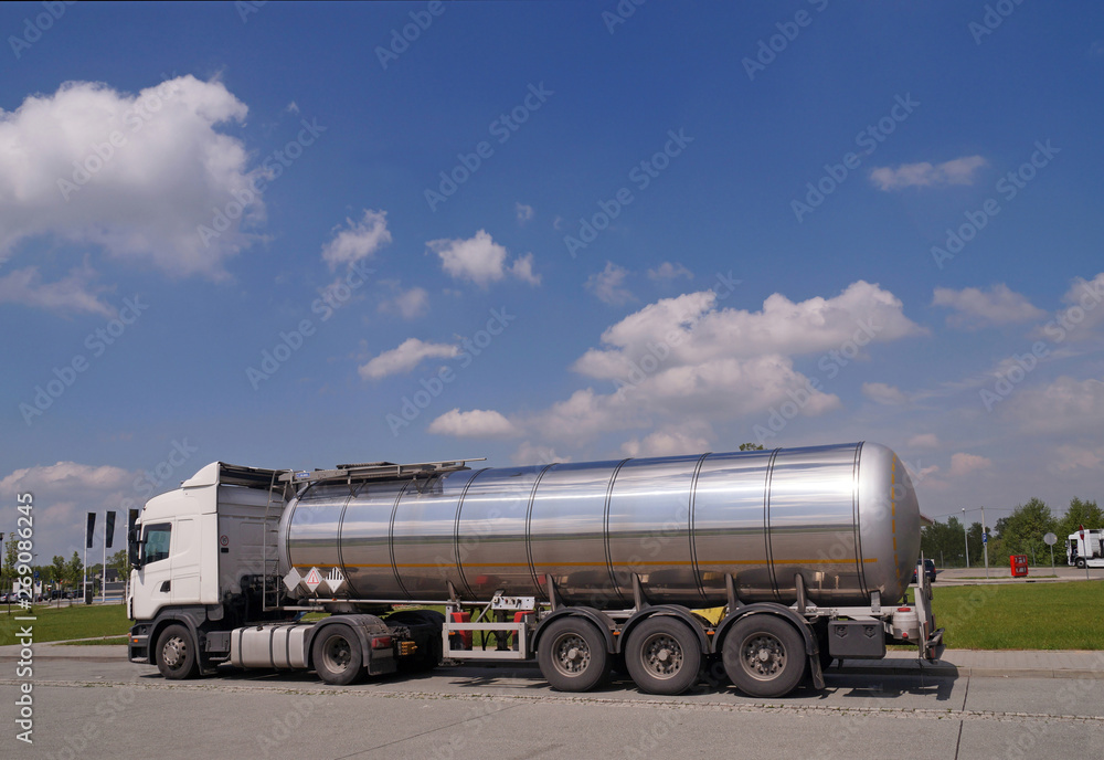 A truck with a tanker designed to transport  of dangerous substances. Long vehicle.