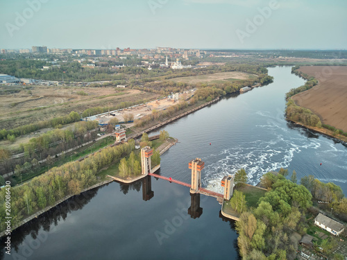 Sluice on the Moscow river near city Dzerzhinsky, aerial drone view on spring
