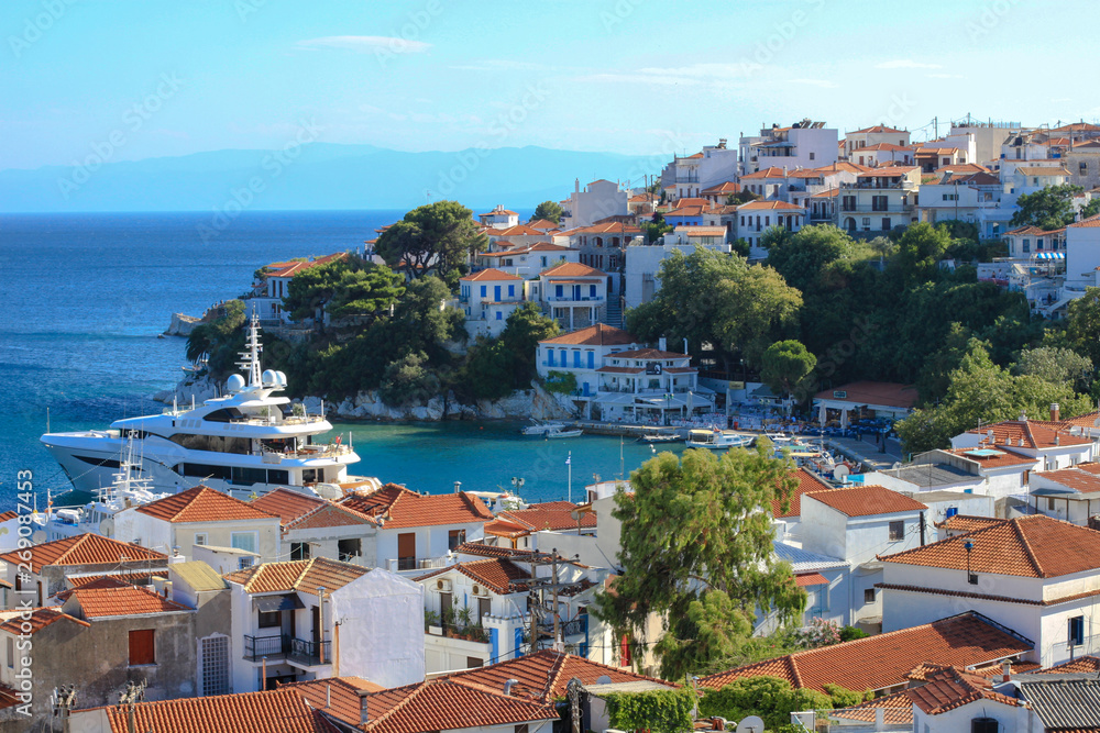 Top view of Skiathos port and typical greek white houses with red roofs, Skiathos island, Greece 