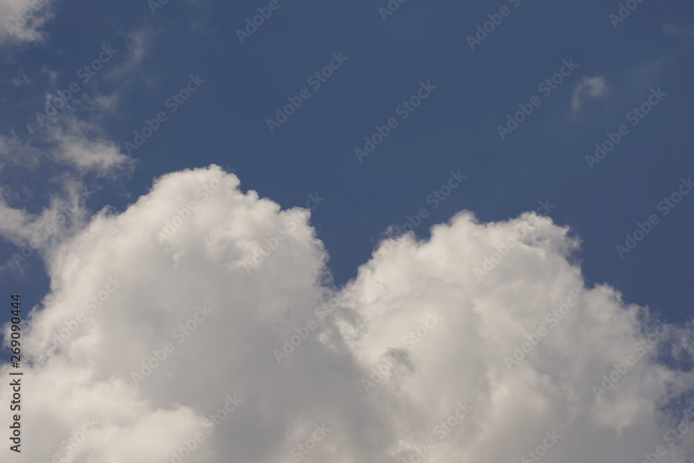 Amazing white fluffy clouds and blue sky on the background, Spring in Georgia USA. Amazing white fluffy clouds and blue sky on the background, Spring in Georgia USA.