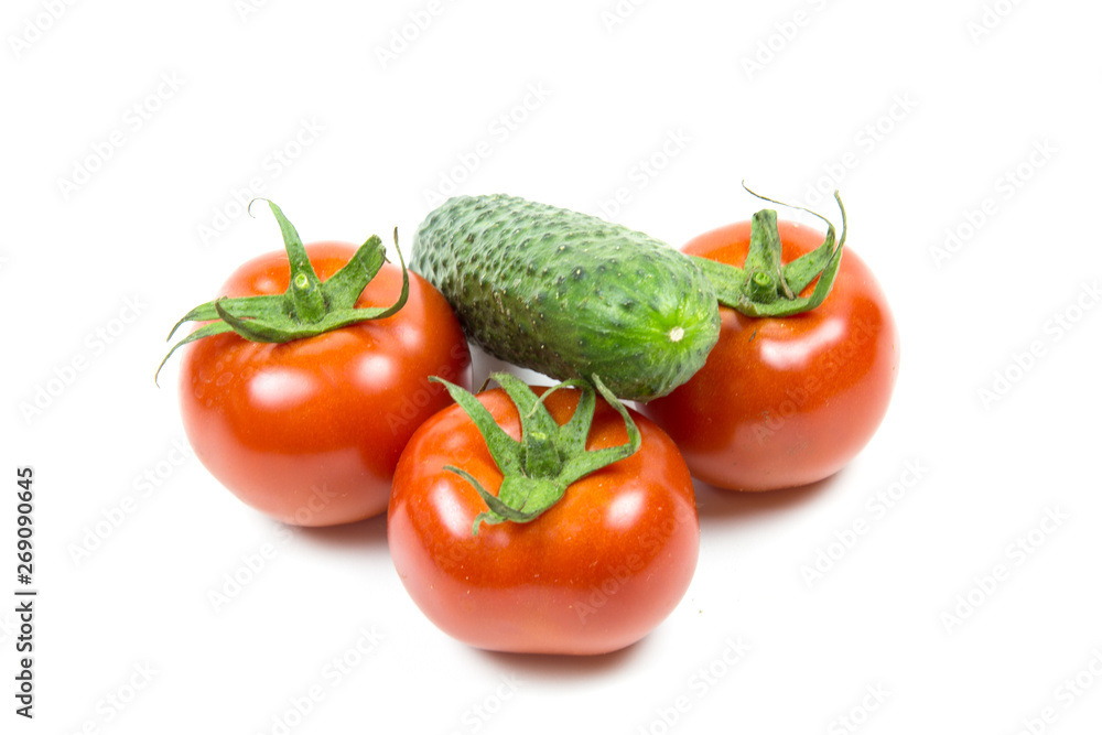 Fresh red tomatoes and cucumbers isolated on white background Food and drink Agriculture Fresh red tomatoes and cucumbers isolated on white background Food and drink Agriculture
