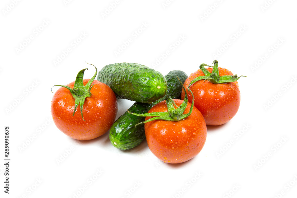 Fresh red tomatoes and cucumbers with water drops isolated on white background Food and drinks Agriculture Fresh red tomatoes and cucumbers with water drops isolated on white background Food and drinks Agriculture