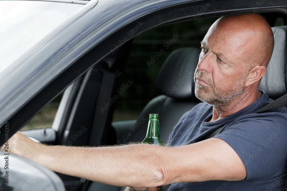 man drinking beer while driving man drinking beer while driving