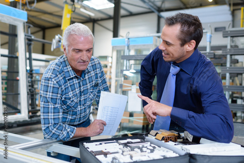 Schilderij op canvas young successful engineer discusses important technical amendments