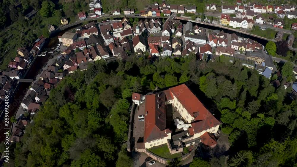 Aerial backwards flight of the Castle and city of Neuenbürg in the black forest.