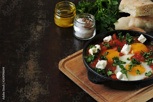 Fried eggs with vegetables and feta cheese. Keto lunch idea. Keto diet. Israeli eggs.
