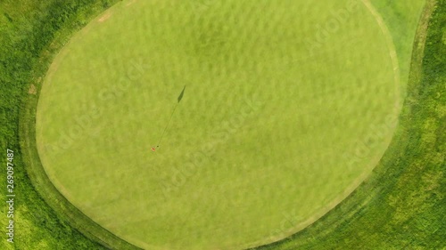 Top down aerial revealing shot of Golf course green and sand trap hazard, no people 4k photo