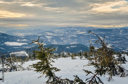 Beautiful winter mountain landscape. Magical snow-covered slopes in the Polish mountains.