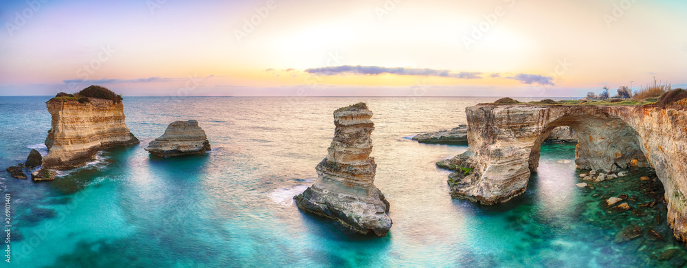 Dramatic seascape with cliffs, rocky arch at Torre Sant Andrea - obrazy, fototapety, plakaty 