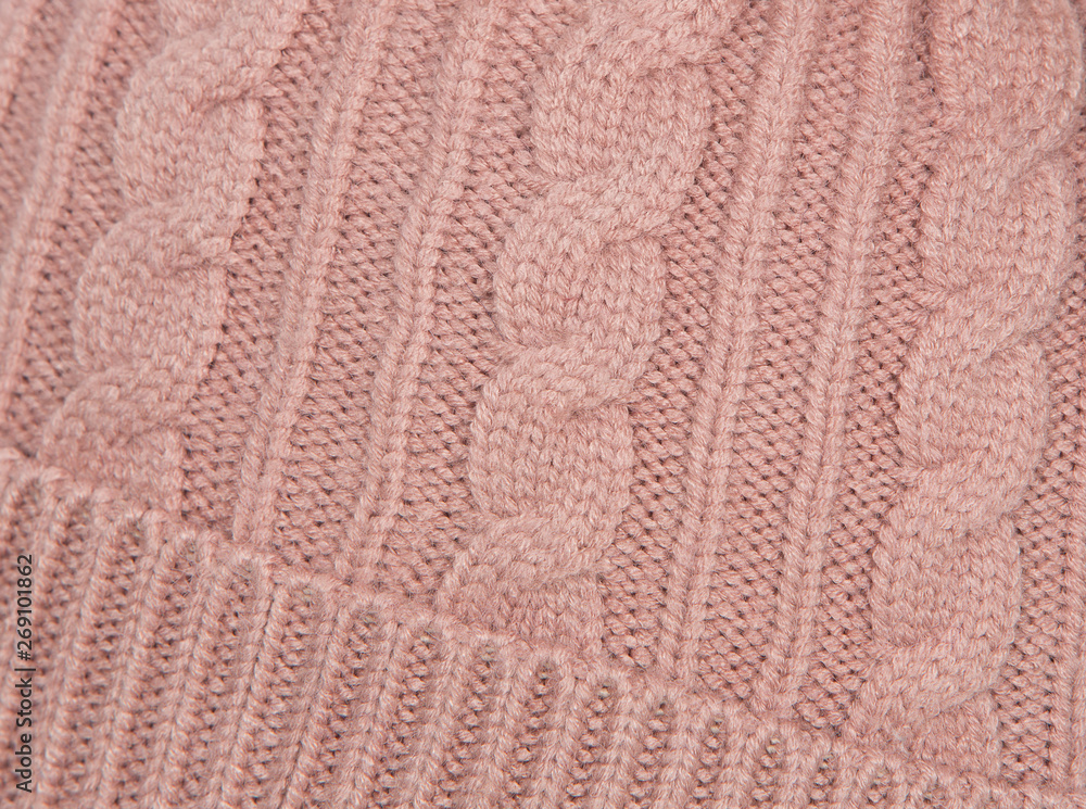 background of knitted wool threads, knitting on the cap, headdress close-up background of knitted wool threads, knitting on the cap, headdress close-up