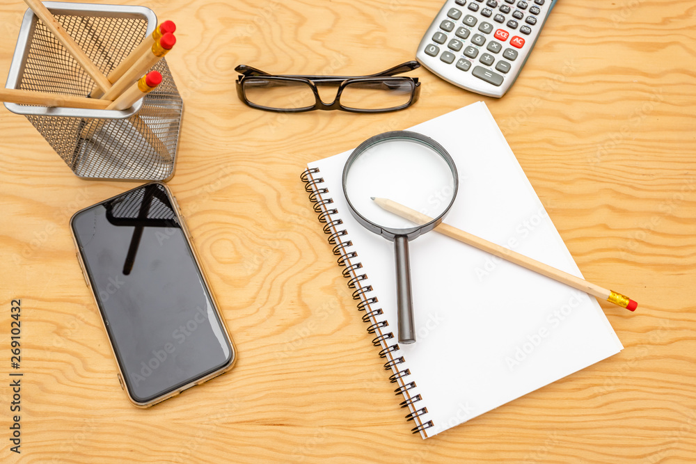top view book , calculator, glasses on wooden table. top view book , calculator, glasses on wooden table.