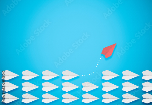 Obraz na plátně different thinking concept.red paper plane leaving the group