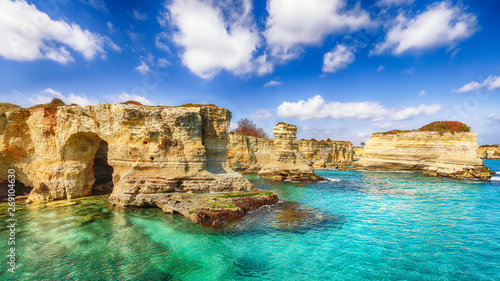 Picturesque seascape with cliffs, rocky arch at Torre Sant Andrea