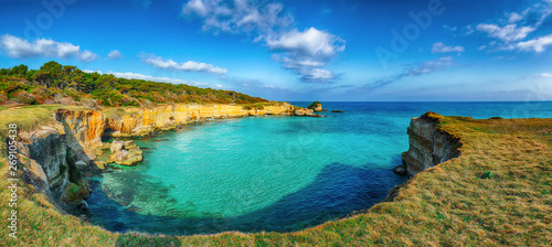Fototapeta Naklejka Na Ścianę i Meble -  Picturesque seascape with white rocky cliffs, sea bay, islets and faraglioni near by beach Spiaggia della Punticeddha