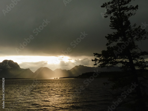 Canvas Print Dramatic sky during sunset at Jackson Lake in Grand Teton National Park