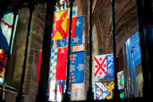 Edinburgh  Scotland - August 10  2010  Flags of several Scottish and English clans hung inside a Scottish church in Edinburgh.