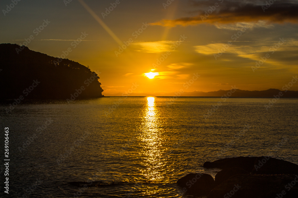 Sunrise at the sea, Abel Tasman National Park, south island, New Zealand.