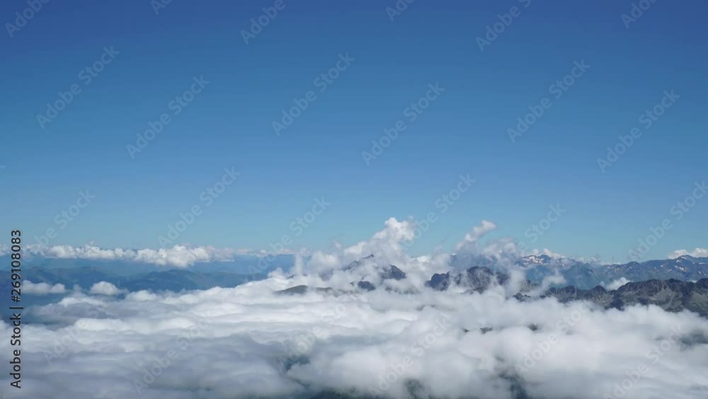 Mountains on Pic du Midi, France with clouds moving on the surface. Bright light shot. 4K UHD Timelapse Mountains on Pic du Midi, France with clouds moving on the surface. Bright light shot. 4K UHD Timelapse