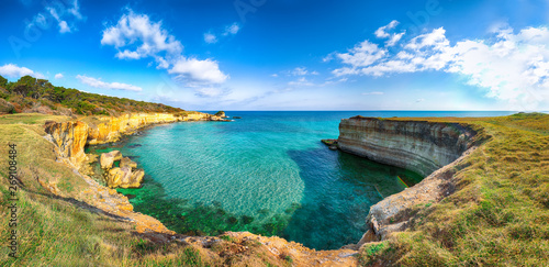 Picturesque seascape with white rocky cliffs, sea bay, islets and faraglioni near by beach Spiaggia della Punticeddha