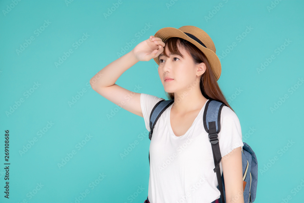 Beautiful portrait young asian woman wear hat on head smile expression confident enjoy summer trip holiday isolated blue background, model girl fashion having backpack, travel concept. Beautiful portrait young asian woman wear hat on head smile expression confident enjoy summer trip holiday isolated blue background, model girl fashion having backpack, travel concept.