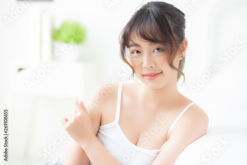 Free Download Beautiful young asian woman applying cream and treatment for skin care touch shoulder, girl with lotion spa and moisturizing for health and wellness body part, lifestyle and beauty cosmetic concept. - GFXLoad