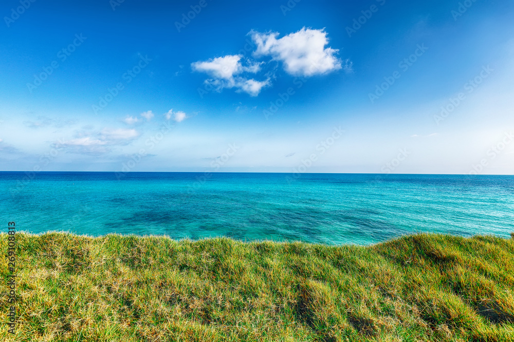 Picturesque seascape with green meadow near Torre Sant Andrea