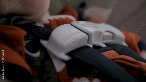 Child Sleeps in Car Seat Close Up