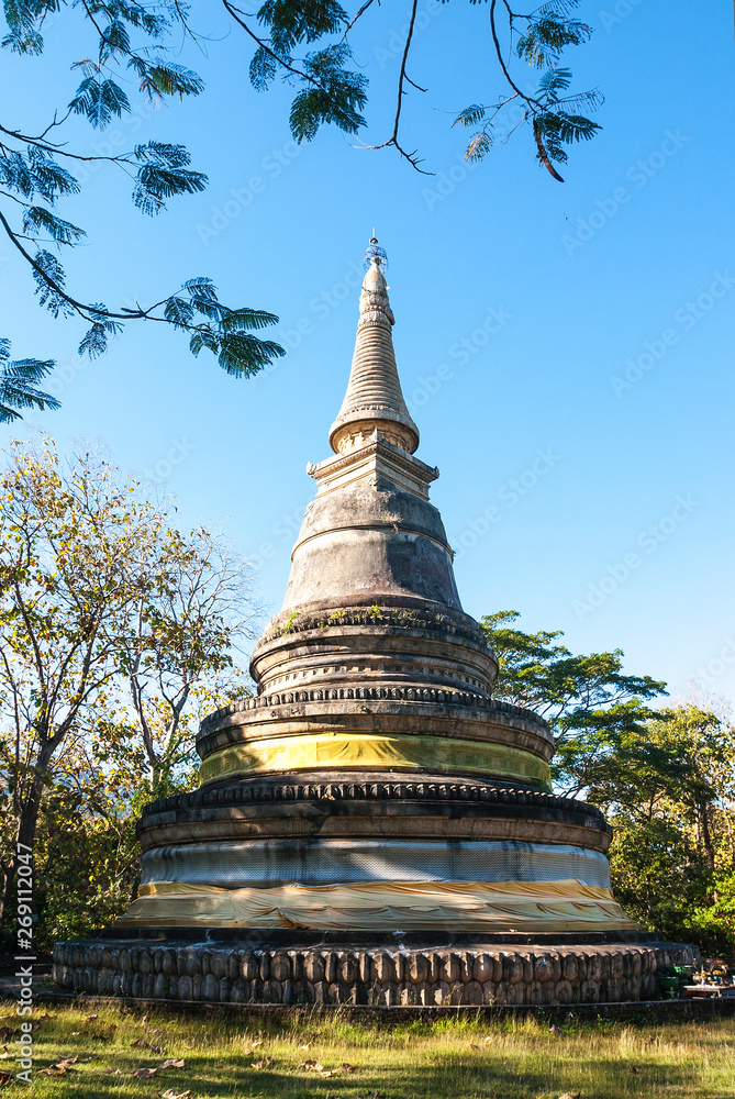 Ancients isolated solo alone pagoda with natural blue sky with puffy white clouds in bright clear sunny day in Temple, Asia