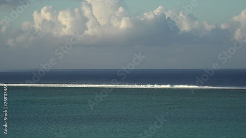 Waves hit the coral reef of the lagoon, Raiatea near Uturoa, French Polynesia photo