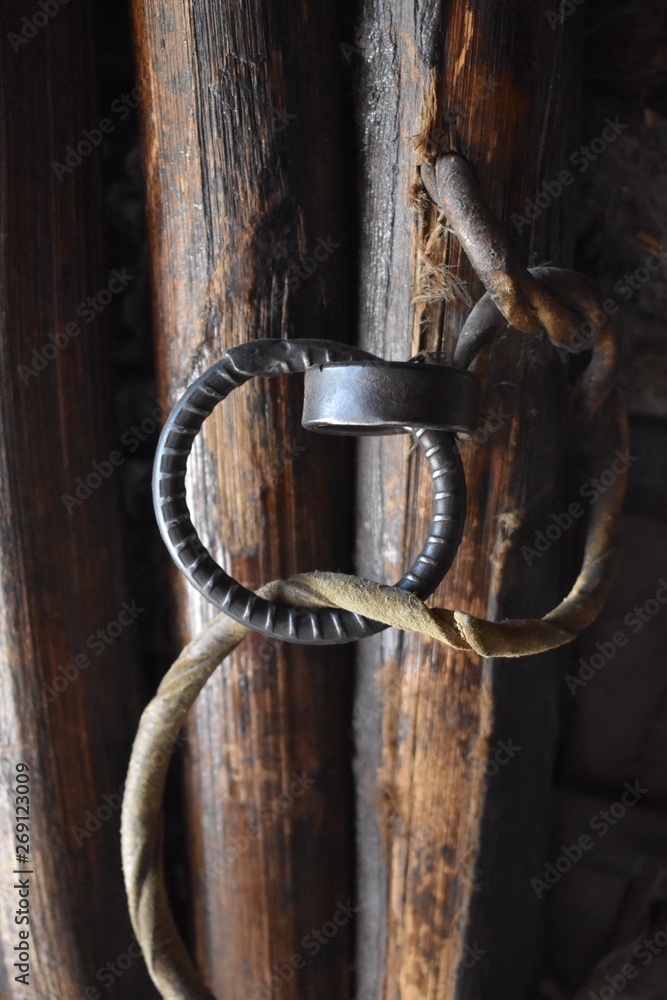 Metal door handle with a leather rope