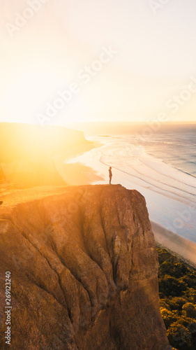 Aerial View of Beautiful Beach Coastline with Person on top of Cliffs Along the Great Ocean Road Australia