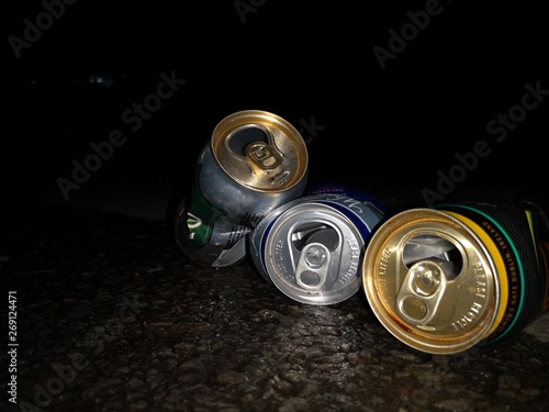 Don't dink and drive message with can beers on the road.