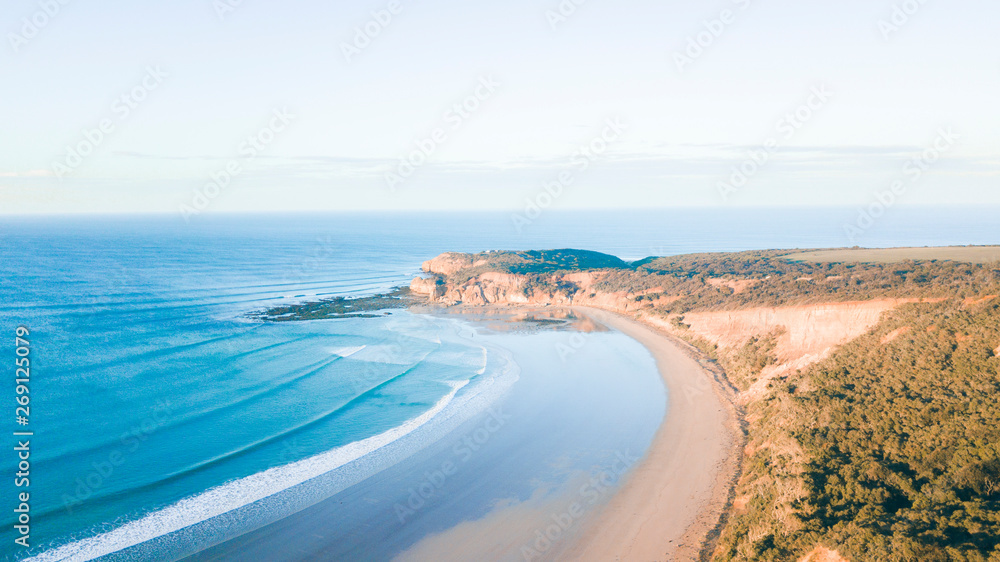 Aerial View of Beautiful Beach Coastline with Person on top of Cliffs Along the Great Ocean Road Australia