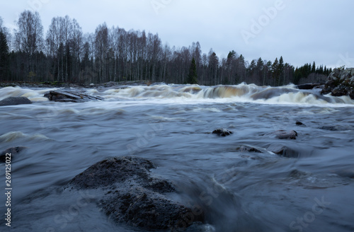 Wild river in sweden photographed daytime in late autumn